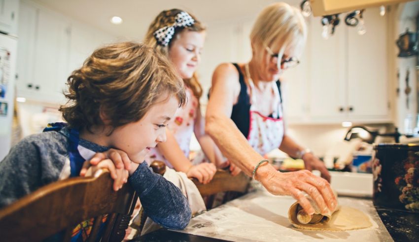 A woman and a child are making cookies in the kitchen.