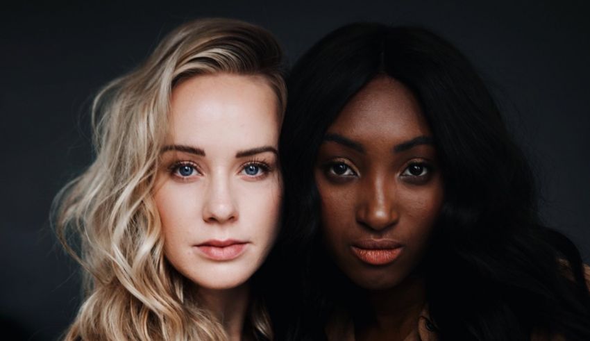 Two black women posing for a photo.