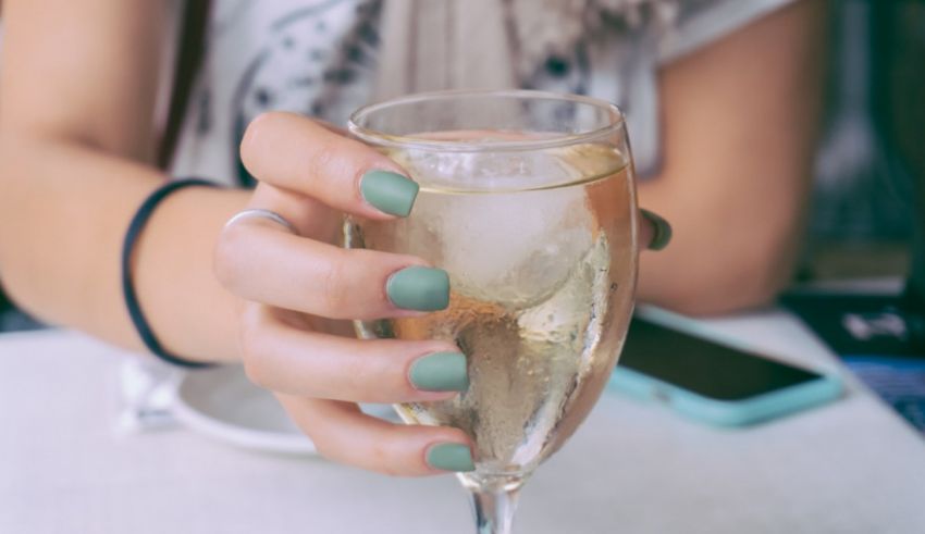 A woman is holding a glass of champagne.