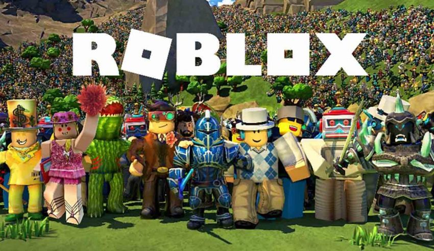 A group of people standing in front of the word roblox.