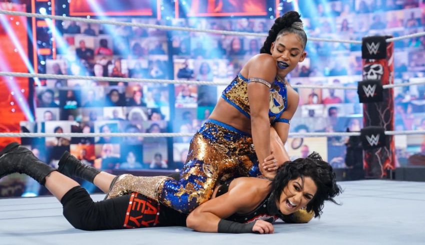 Two women wrestling in a wwe ring.