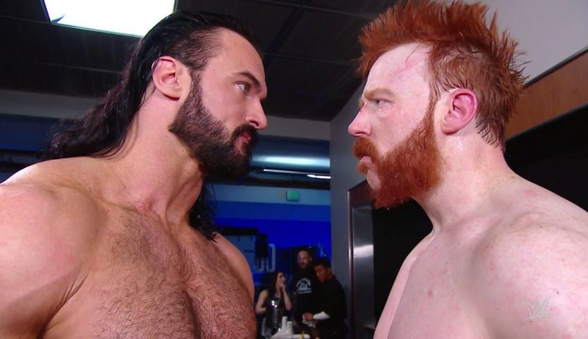 Two wrestlers with red hair standing next to each other.