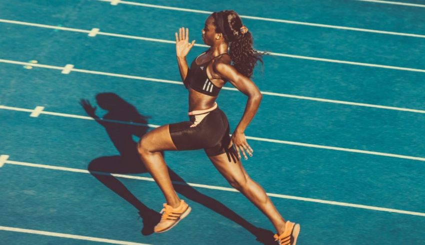 A woman is running on a track.