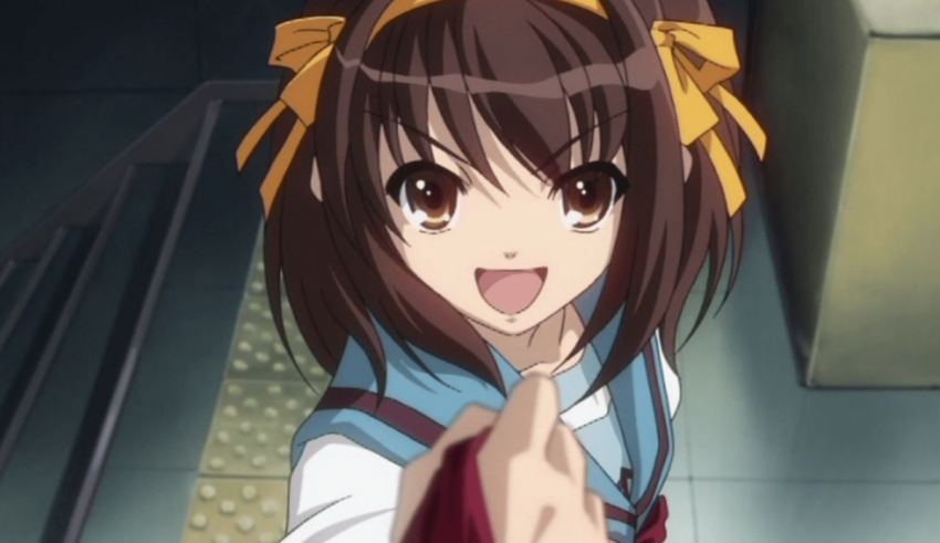 An anime girl with long brown hair is pointing at something.