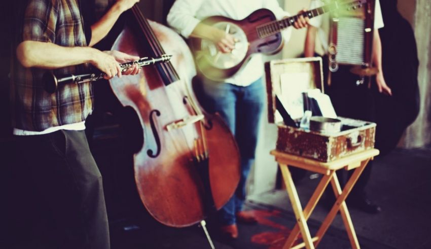 A group of people playing instruments in front of a building.