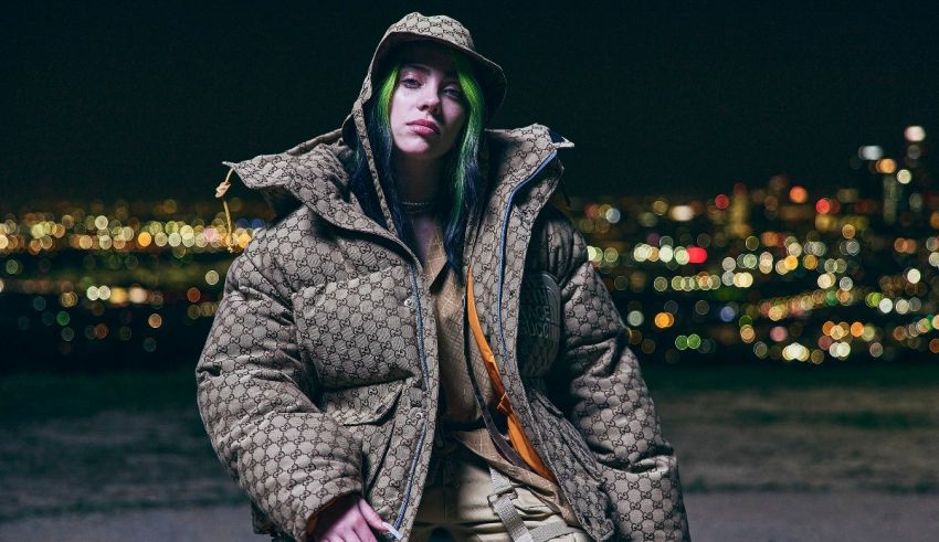 A woman with green hair standing in front of a city at night.