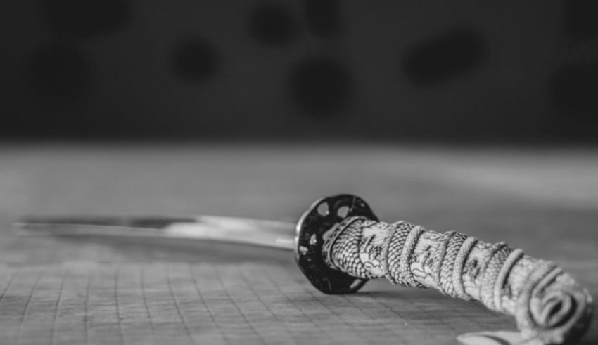 A black and white image of a samurai sword.