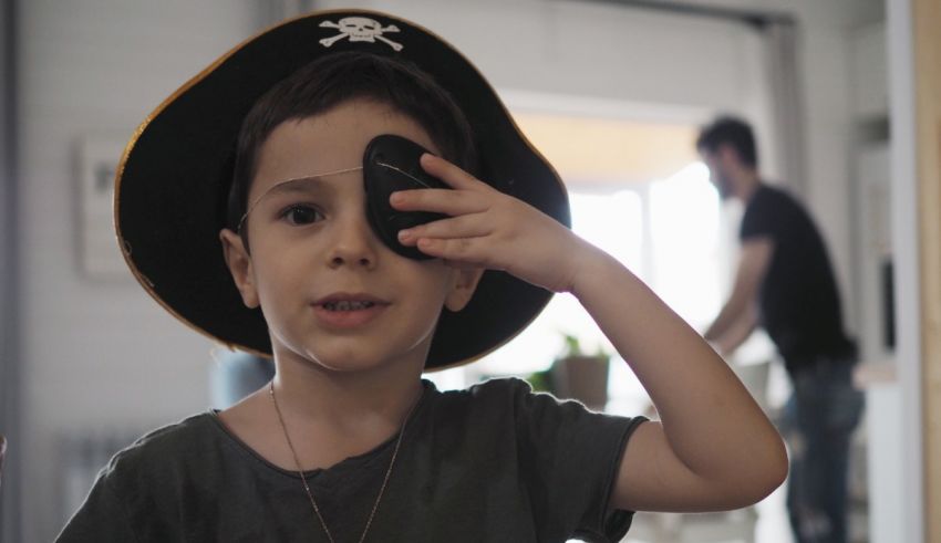 A young boy wearing a pirate hat.