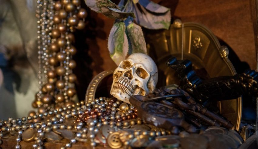 A skull, beads, and other items are displayed on a table.