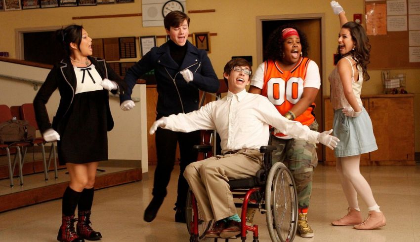 A group of people in a wheelchair in a classroom.