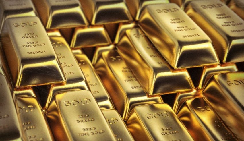 Many gold bars are piled up in a pile.