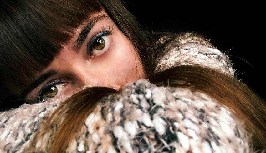 A close up of a woman with brown eyes.