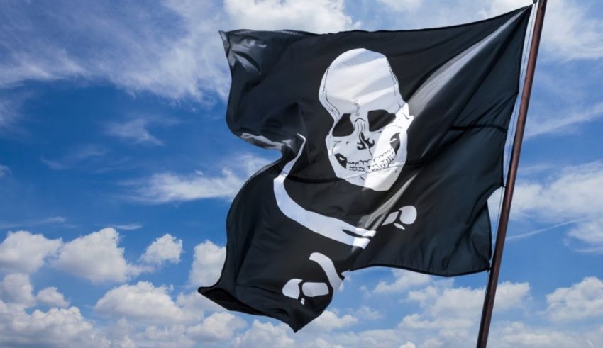 A black and white pirate flag flying in the sky.