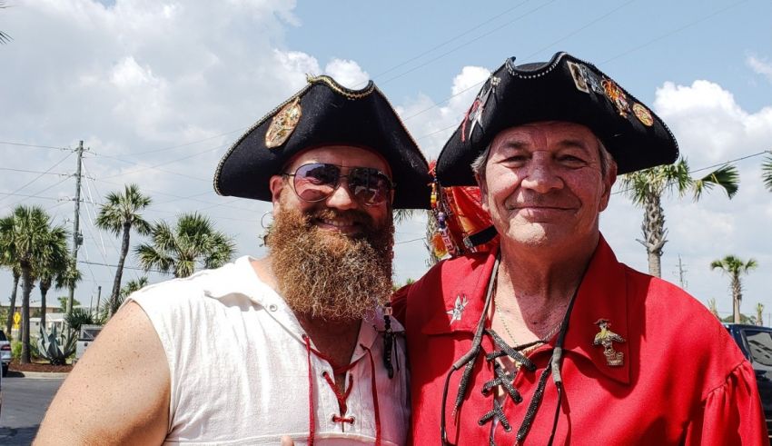 Two men in pirate hats posing for a photo.