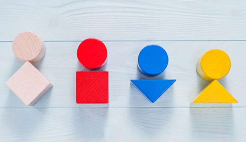 A group of colorful wooden blocks on a blue background.