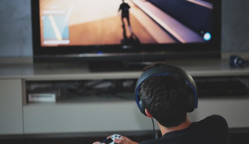 A boy is playing a video game on a tv.