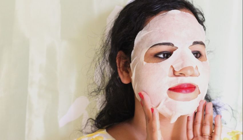 A woman with a face mask on her face.