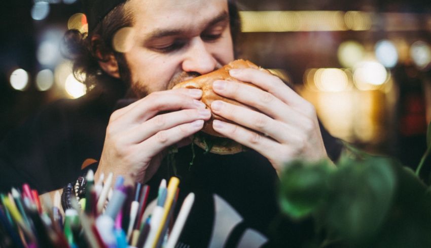 A man eating a burger.