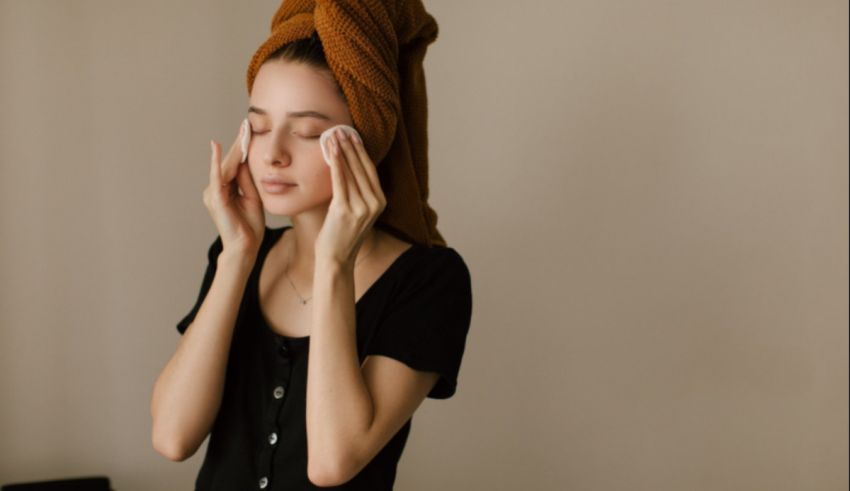 A woman with a towel covering her face.