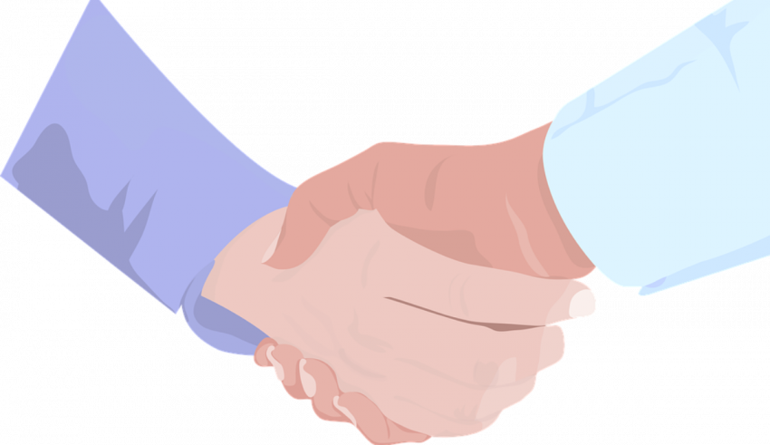 A handshake between two people on a black background.