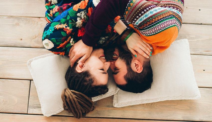 A man and woman lying on the floor.