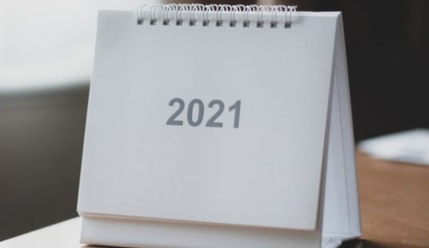 A calendar with the word 2021 on it sitting on a table.