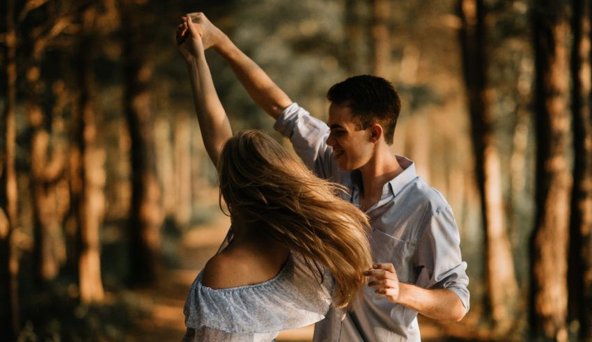 A couple dancing in the woods.