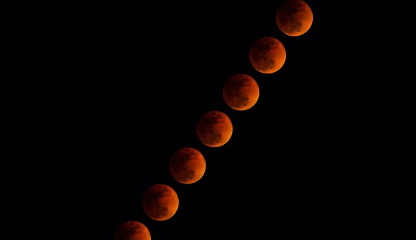 A series of red blood moons in the sky.