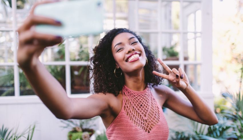 A woman taking a selfie.