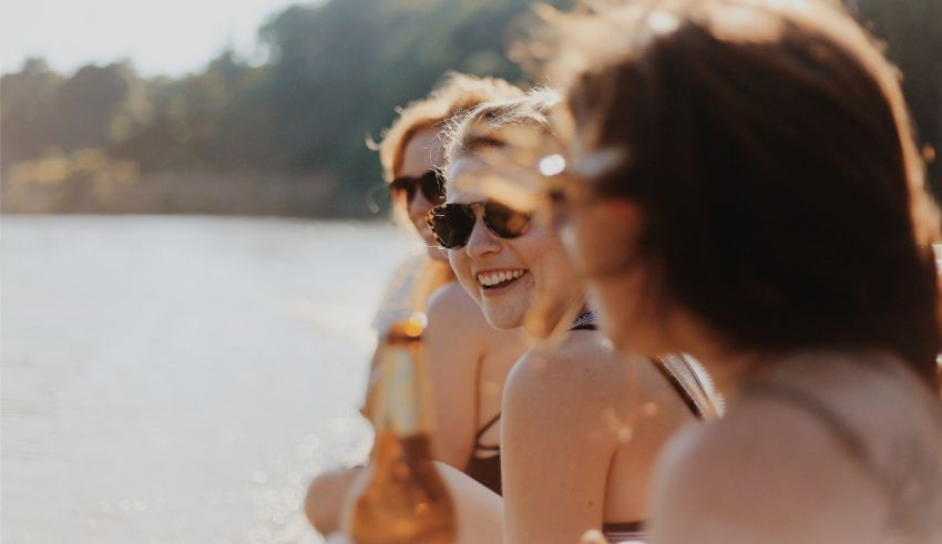 A group of women sitting on a boat.