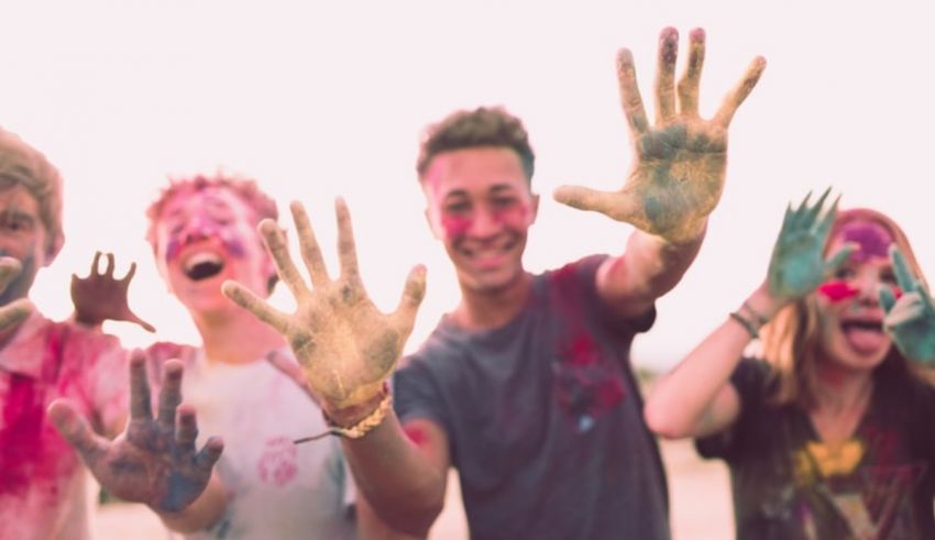 A group of people with paint on their hands.