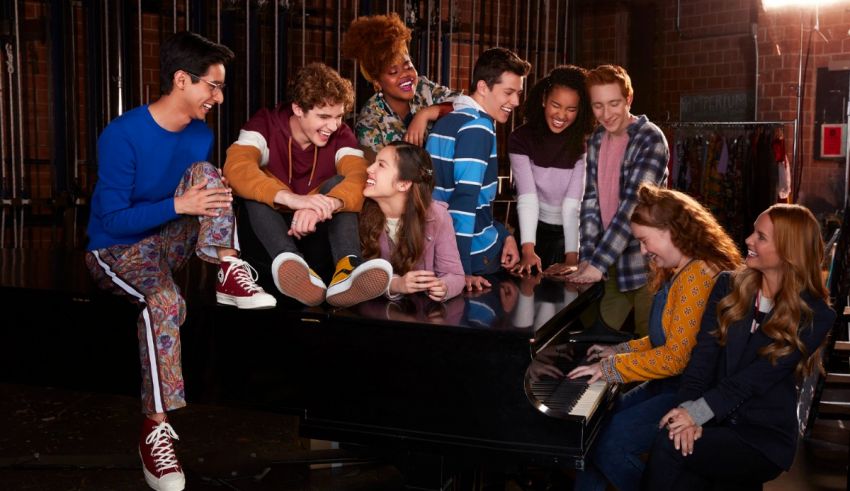 A group of young people sitting around a piano.