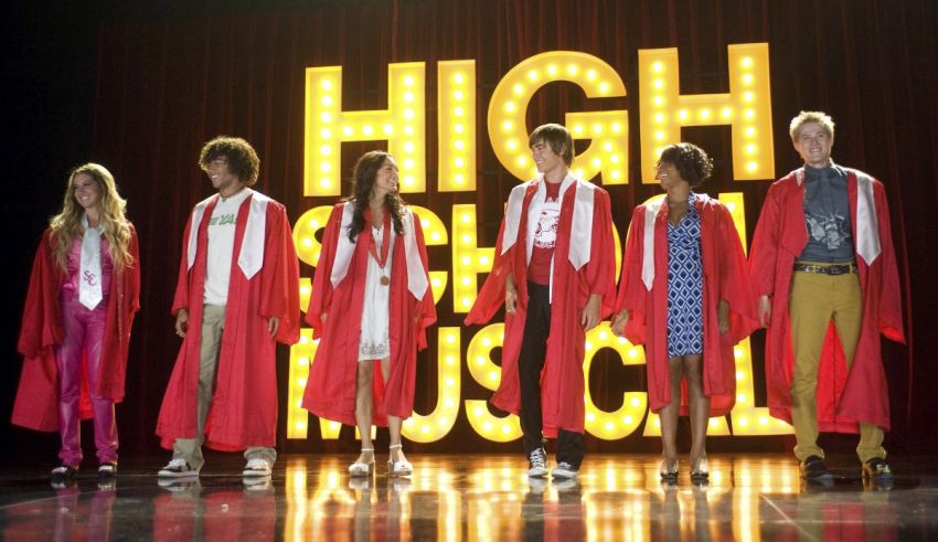 The cast of high school musical standing on stage.