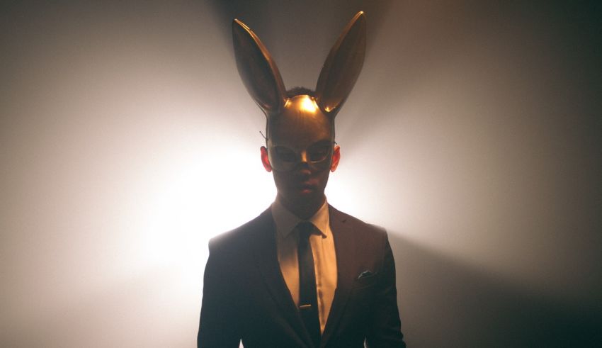 A man in a suit with bunny ears.