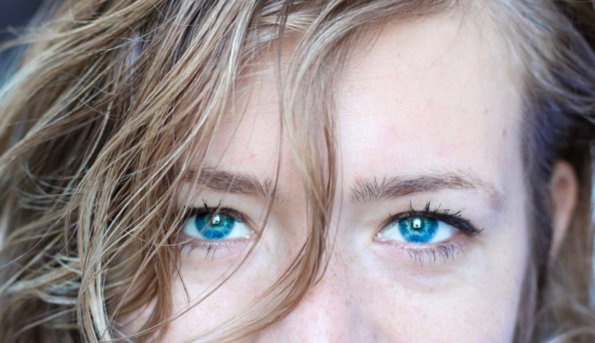 A close up of a woman with blue eyes.