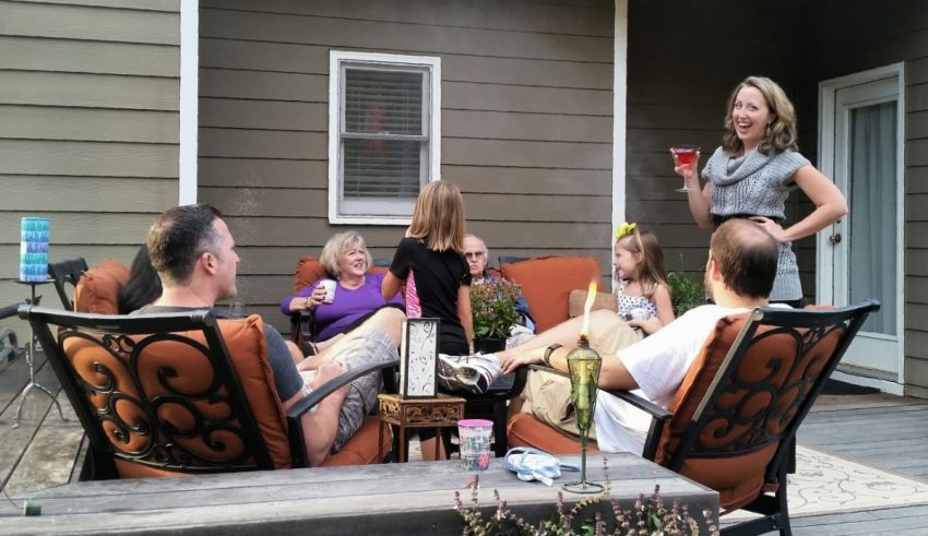 A group of people sitting on a patio with drinks.