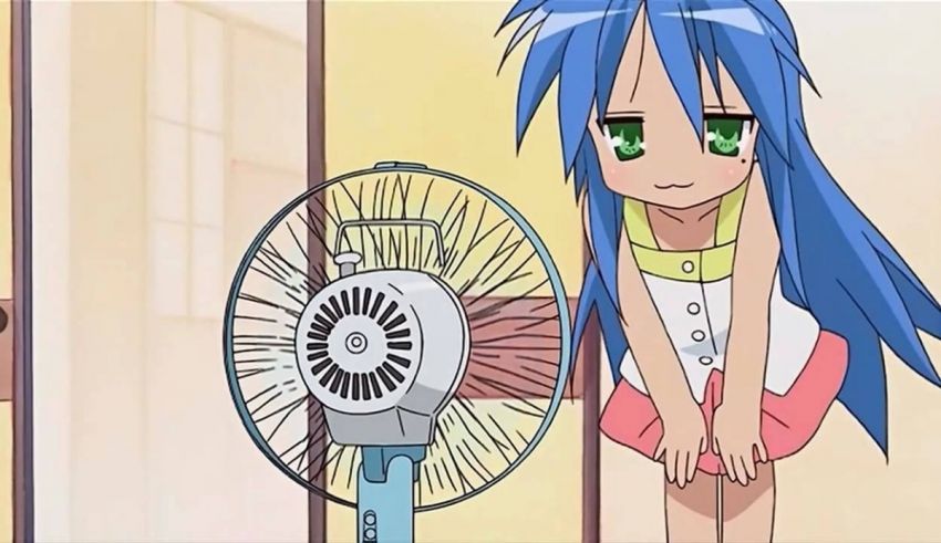 A girl with blue hair standing next to a fan.