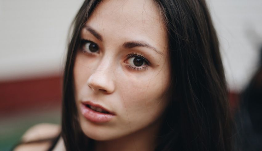 A close up of a woman with dark hair.