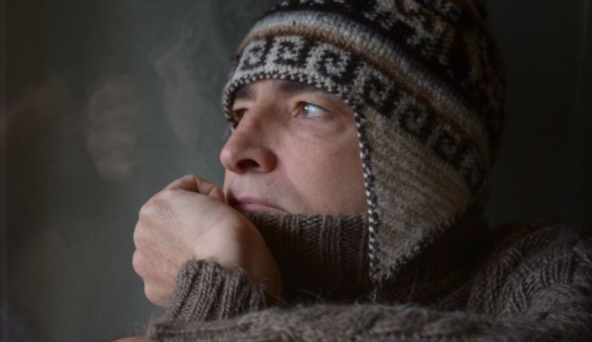 A man in a knitted hat and scarf.