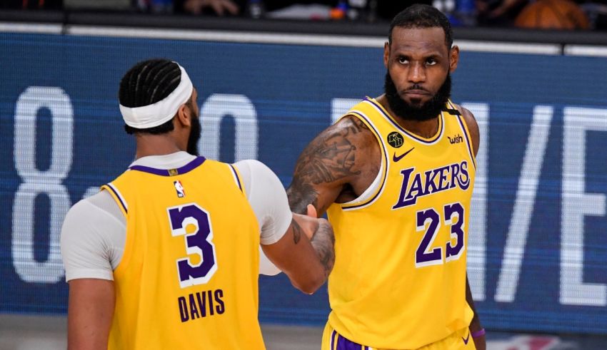 Two los angeles lakers players standing next to each other.