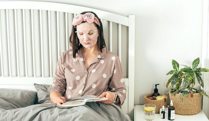 A woman reading a book while sitting in bed.