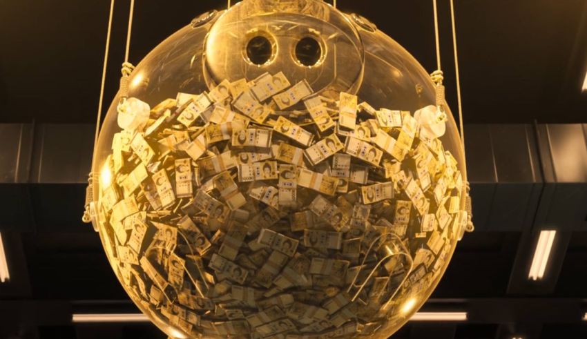 A golden egg filled with money hanging from the ceiling.