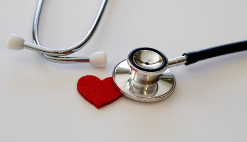 A stethoscope and a red heart on a white background.