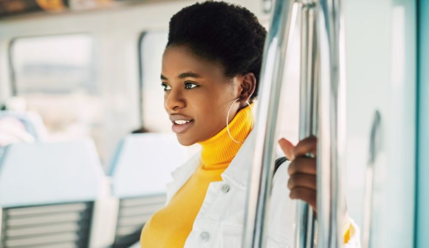 A young african american woman on a train.