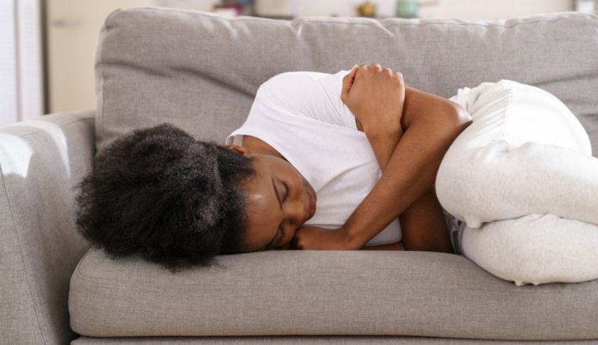 A woman sleeping on a couch at home.