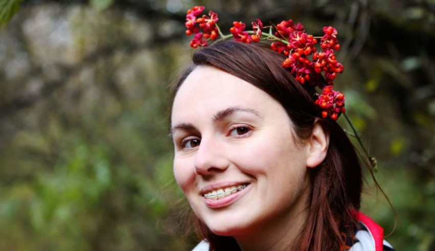 A woman wearing a red berry crown.