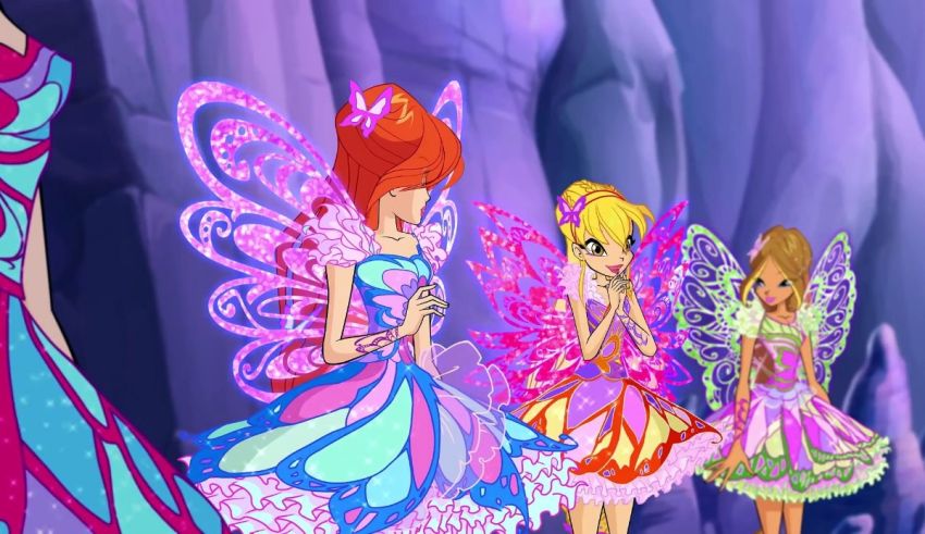 A group of fairy princesses are standing in front of a rock.