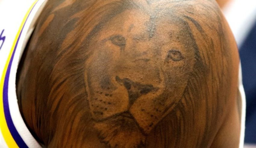 A lion tattoo on the shoulder of a basketball player.