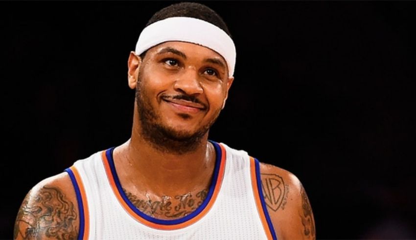 The new york knicks player is wearing a headband.