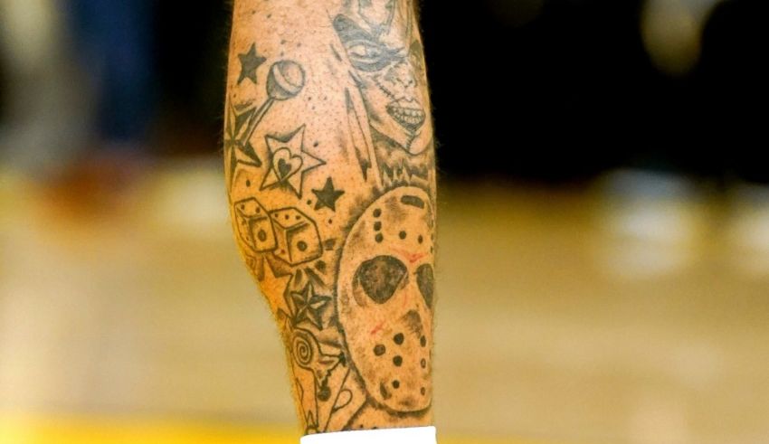 A basketball player has a tattoo on his leg.